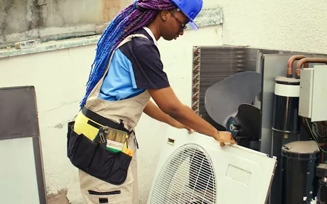 Commercial HVAC installation on a rooftop, showing units and piping.